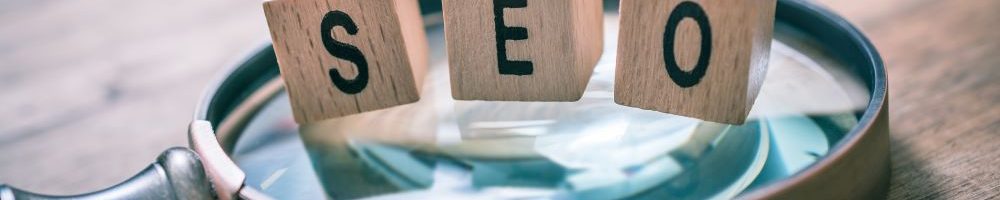 close-up-magnifying-glass-with-toy-blocks-table